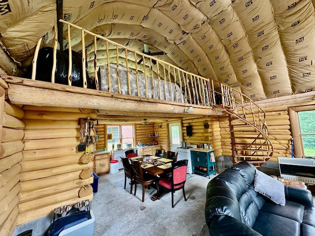 3274 County Road 1 SW, Boone Twp, MN 56623 - dining area featuring a high ceiling and rustic walls