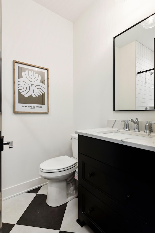 5240 Polaris Ln N, Plymouth, MN 55446 - full bathroom featuring tile patterned floors, vanity, toilet, baseboards, and a shower