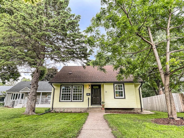 4241 Tyler St NE, Columbia Heights, MN 55421 - view of front of property with a shingled roof and covered porch