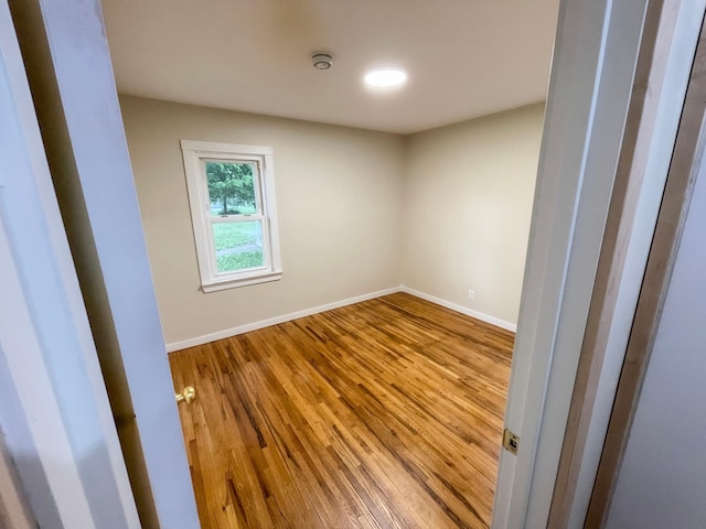 4241 Tyler St NE, Columbia Heights, MN 55421 - spare room with wood finished floors and a smoke detector