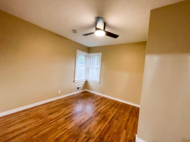 4241 Tyler St NE, Columbia Heights, MN 55421 - unfurnished room featuring a ceiling fan and wood finished floors