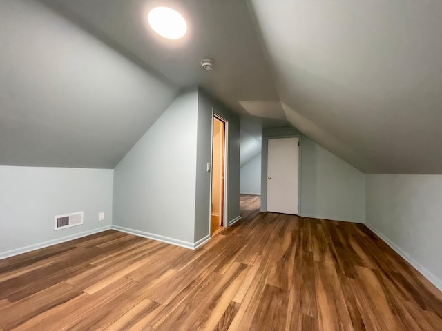4241 Tyler St NE, Columbia Heights, MN 55421 - additional living space with wood finished floors and vaulted ceiling