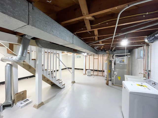 4241 Tyler St NE, Columbia Heights, MN 55421 - unfinished below grade area with water heater, stairs, and heating unit
