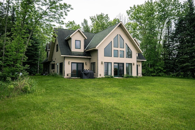 10804 Splithand Rd, Wildwood Twp, MN 55744 - rear view of house with a lawn and roof with shingles