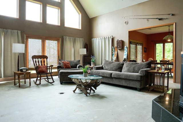 10804 Splithand Rd, Wildwood Twp, MN 55744 - living room featuring high vaulted ceiling and concrete flooring