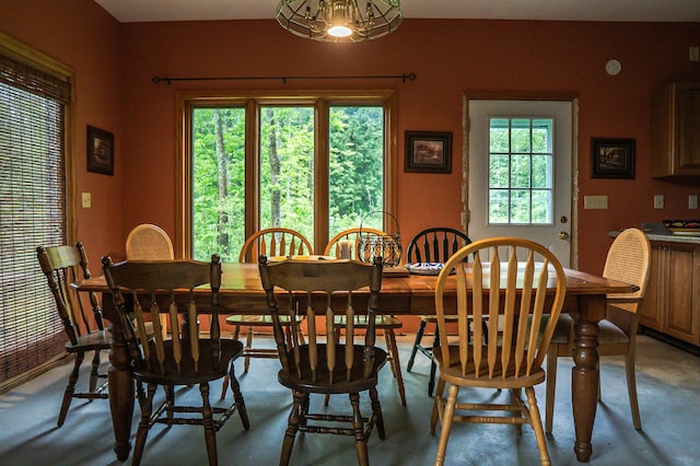 10804 Splithand Rd, Wildwood Twp, MN 55744 - dining room featuring a chandelier, finished concrete floors, and baseboards