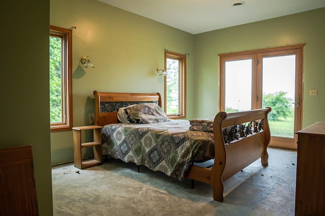 10804 Splithand Rd, Wildwood Twp, MN 55744 - carpeted bedroom featuring access to exterior and multiple windows