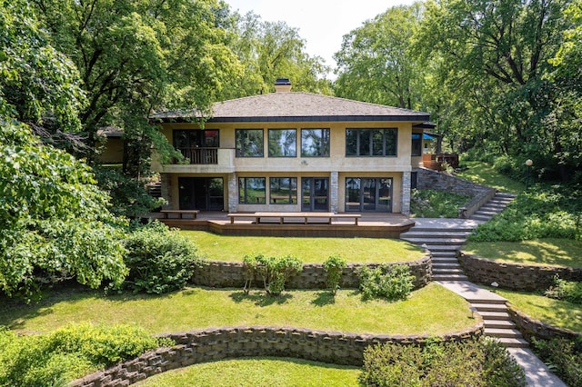 28647 State Highway 78, Otter Tail Twp, MN 56515 - back of house with stairway, a balcony, a yard, and a chimney