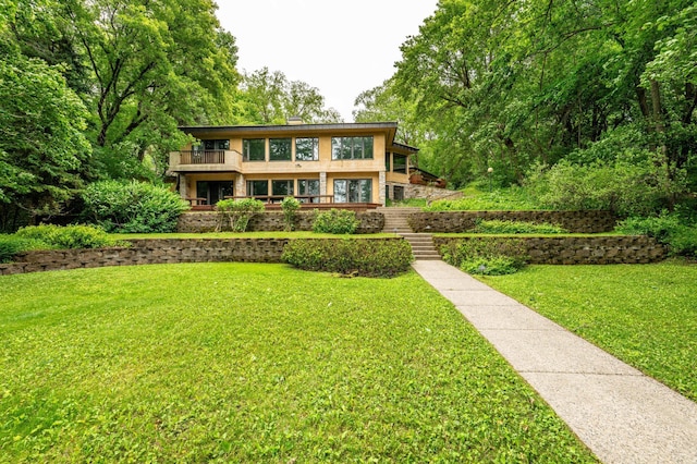28647 State Highway 78, Otter Tail Twp, MN 56515 - rear view of property featuring a balcony, a yard, and stairway