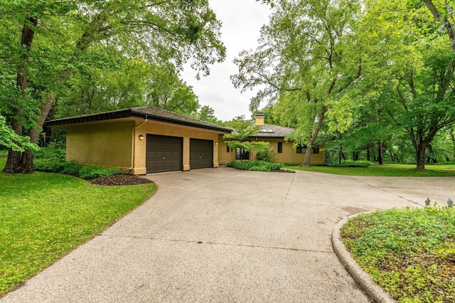 28647 State Highway 78, Otter Tail Twp, MN 56515 - view of front of property featuring stucco siding, an attached garage, driveway, and a front lawn