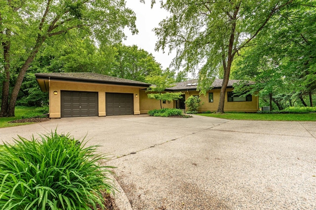 28647 State Highway 78, Otter Tail Twp, MN 56515 - view of front of property featuring concrete driveway, stucco siding, and an attached garage
