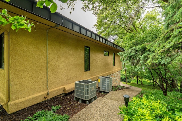 28647 State Highway 78, Otter Tail Twp, MN 56515 - view of side of property with a cooling unit and stucco siding