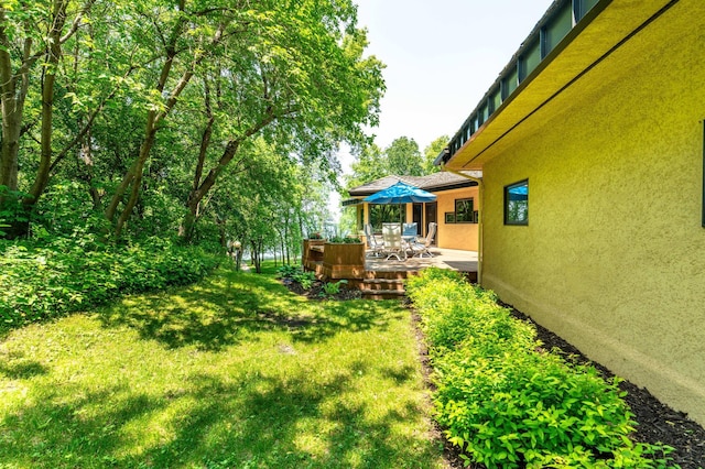 28647 State Highway 78, Otter Tail Twp, MN 56515 - view of grassy yard with a wooden deck and outdoor dining space