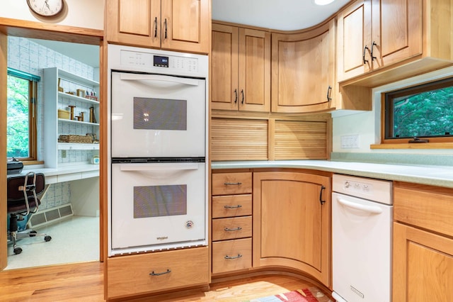28647 State Highway 78, Otter Tail Twp, MN 56515 - kitchen featuring white appliances, light countertops, and light wood-style floors