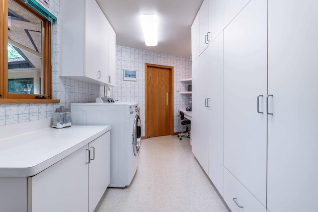 28647 State Highway 78, Otter Tail Twp, MN 56515 - laundry room with cabinet space, washing machine and dryer, a desk, and tile walls