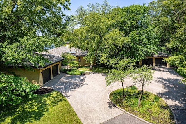 28647 State Highway 78, Otter Tail Twp, MN 56515 - view of front of house featuring driveway, stucco siding, an attached garage, and a chimney