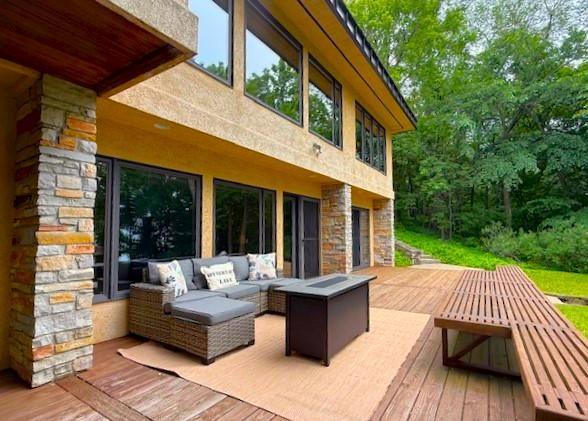 28647 State Highway 78, Otter Tail Twp, MN 56515 - wooden terrace with outdoor lounge area