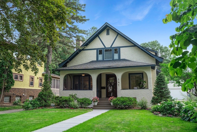 141 Rustic Ldg W, Minneapolis, MN 55419 - english style home featuring stucco siding, a front lawn, and covered porch