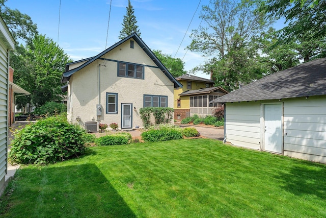 141 Rustic Ldg W, Minneapolis, MN 55419 - rear view of property with a lawn, stucco siding, and an outbuilding