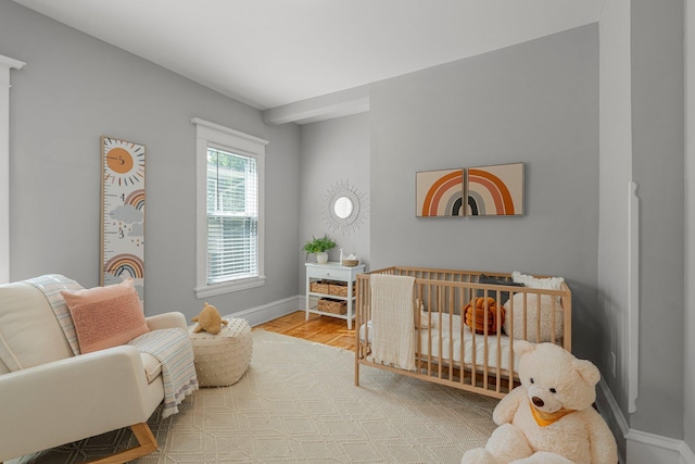 141 Rustic Ldg W, Minneapolis, MN 55419 - bedroom featuring wood finished floors and a nursery area