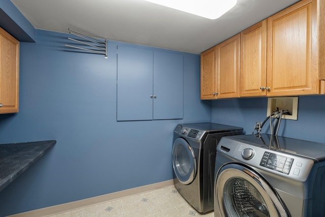141 Rustic Ldg W, Minneapolis, MN 55419 - laundry area with cabinet space, washer and clothes dryer, and light tile patterned floors