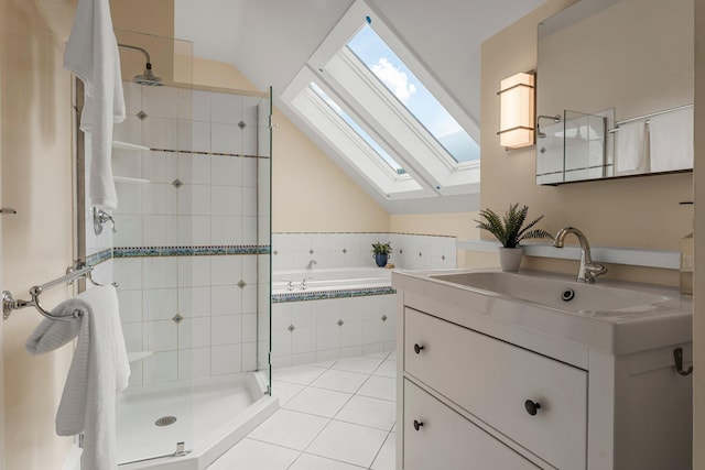 141 Rustic Ldg W, Minneapolis, MN 55419 - full bath with a skylight, tile patterned flooring, vanity, vaulted ceiling, and a tile shower