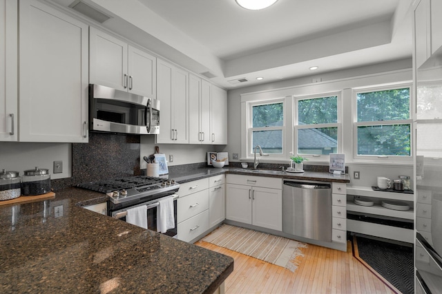 141 Rustic Ldg W, Minneapolis, MN 55419 - kitchen with stainless steel appliances, light wood finished floors, white cabinets, and recessed lighting