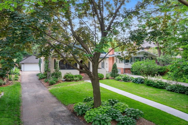 141 Rustic Ldg W, Minneapolis, MN 55419 - view of property hidden behind natural elements with a front yard and a garage