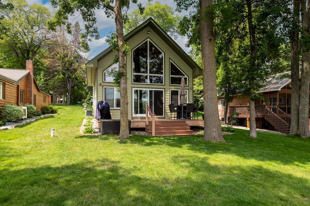 12088 Sylvan Dr SW, Pillager, MN 56473 - back of property featuring a deck, a lawn, and stairs