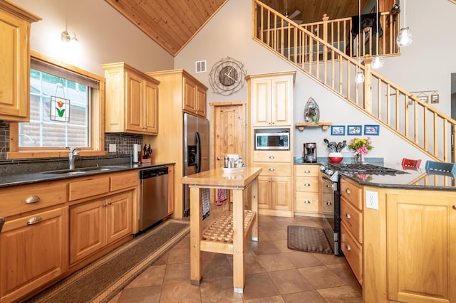 12088 Sylvan Dr SW, Pillager, MN 56473 - kitchen with stainless steel appliances, wood ceiling, a sink, high vaulted ceiling, and tasteful backsplash