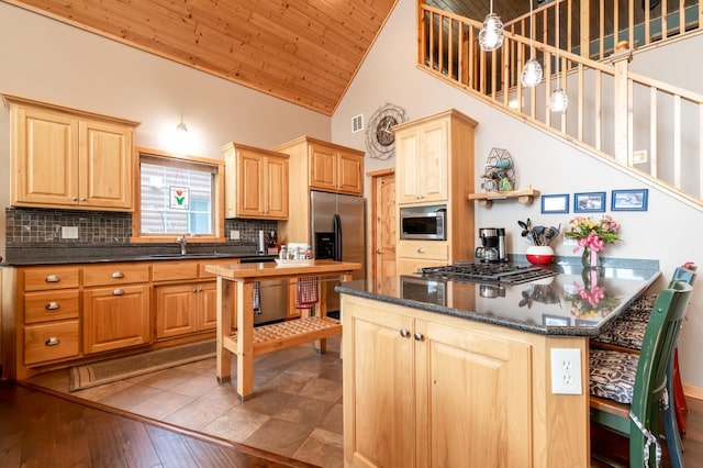 12088 Sylvan Dr SW, Pillager, MN 56473 - kitchen featuring light brown cabinets, appliances with stainless steel finishes, wooden ceiling, high vaulted ceiling, and tasteful backsplash