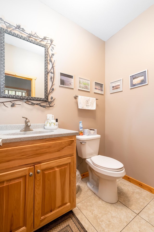 12088 Sylvan Dr SW, Pillager, MN 56473 - bathroom featuring tile patterned floors, toilet, vanity, and baseboards