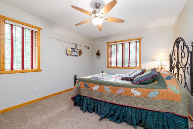 12088 Sylvan Dr SW, Pillager, MN 56473 - bedroom with multiple windows, carpet flooring, baseboards, and a ceiling fan