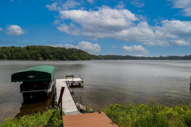 12088 Sylvan Dr SW, Pillager, MN 56473 - dock area featuring a water view, a wooded view, and boat lift