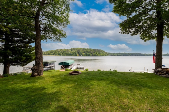 12088 Sylvan Dr SW, Pillager, MN 56473 - water view featuring a boat dock and a fire pit