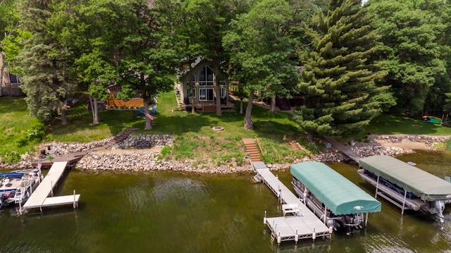 12088 Sylvan Dr SW, Pillager, MN 56473 - dock area featuring a water view, boat lift, stairway, and a yard