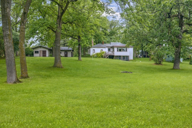 16584 River Rd, Green Prairie Twp, MN 56345 - view of green lawn featuring a wooden deck