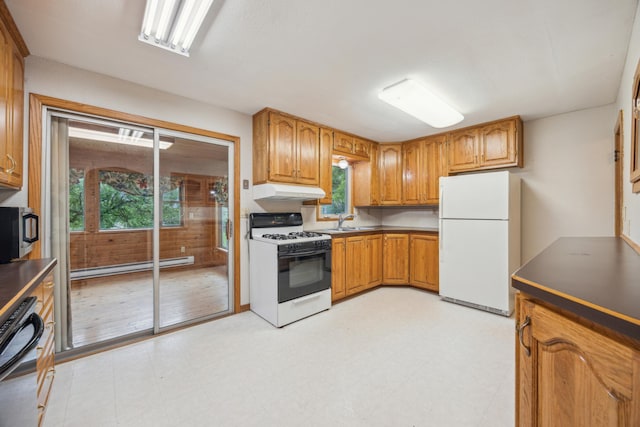 16584 River Rd, Green Prairie Twp, MN 56345 - kitchen featuring white appliances, healthy amount of natural light, under cabinet range hood, and light flooring