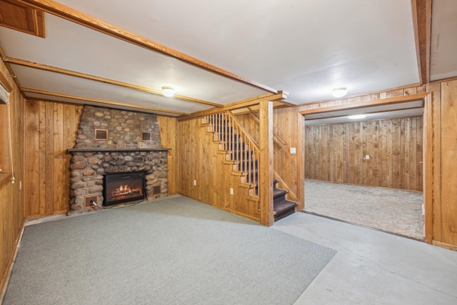 16584 River Rd, Green Prairie Twp, MN 56345 - finished basement with wood walls, stairs, a stone fireplace, and carpet floors