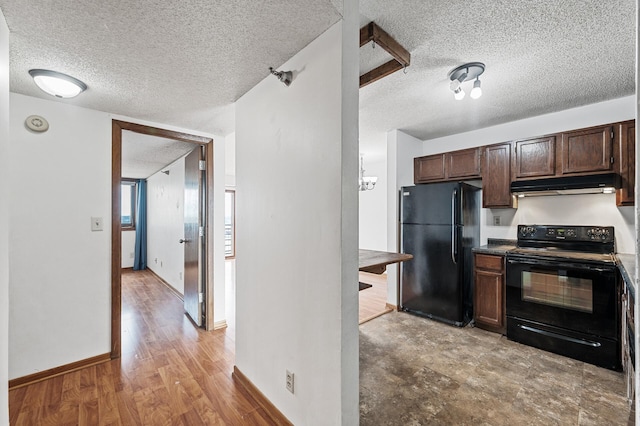 66 9th St E Unit 1806, Saint Paul, MN 55101 - kitchen with black appliances, under cabinet range hood, a textured ceiling, dark brown cabinetry, and light wood finished floors