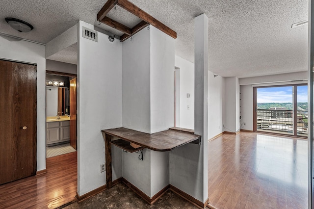 66 9th St E Unit 1806, Saint Paul, MN 55101 - hall with a textured ceiling and wood finished floors