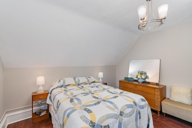 190 Annapolis St E, West Saint Paul, MN 55118 - bedroom featuring dark wood-style flooring, lofted ceiling, and a chandelier