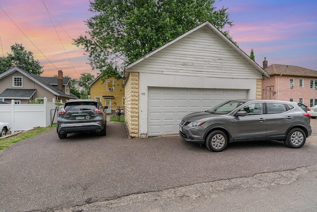 190 Annapolis St E, West Saint Paul, MN 55118 - property exterior at dusk featuring a garage and brick siding