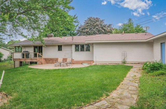 2434 Southcrest Ave E, Maplewood, MN 55119 - back of house featuring a wooden deck, a patio area, a chimney, and roof with shingles