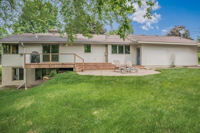 2434 Southcrest Ave E, Maplewood, MN 55119 - back of house featuring a patio, a yard, a chimney, and a wooden deck