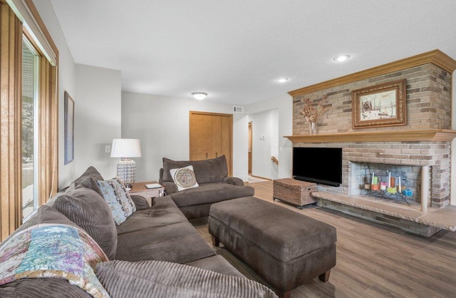 2434 Southcrest Ave E, Maplewood, MN 55119 - living room with wood finished floors, healthy amount of natural light, recessed lighting, and a fireplace