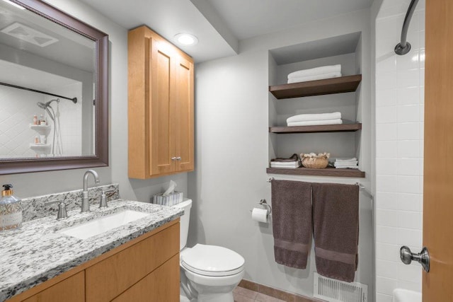 2434 Southcrest Ave E, Maplewood, MN 55119 - bathroom with vanity, toilet, and tile patterned flooring