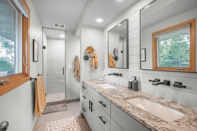 2434 Southcrest Ave E, Maplewood, MN 55119 - bathroom with a shower stall, double vanity, baseboards, recessed lighting, and tile patterned floors