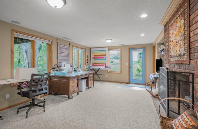 2434 Southcrest Ave E, Maplewood, MN 55119 - office area with a textured ceiling, baseboards, a fireplace, light colored carpet, and recessed lighting
