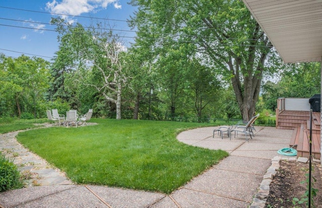 2434 Southcrest Ave E, Maplewood, MN 55119 - view of grassy yard featuring a patio area and view of scattered trees